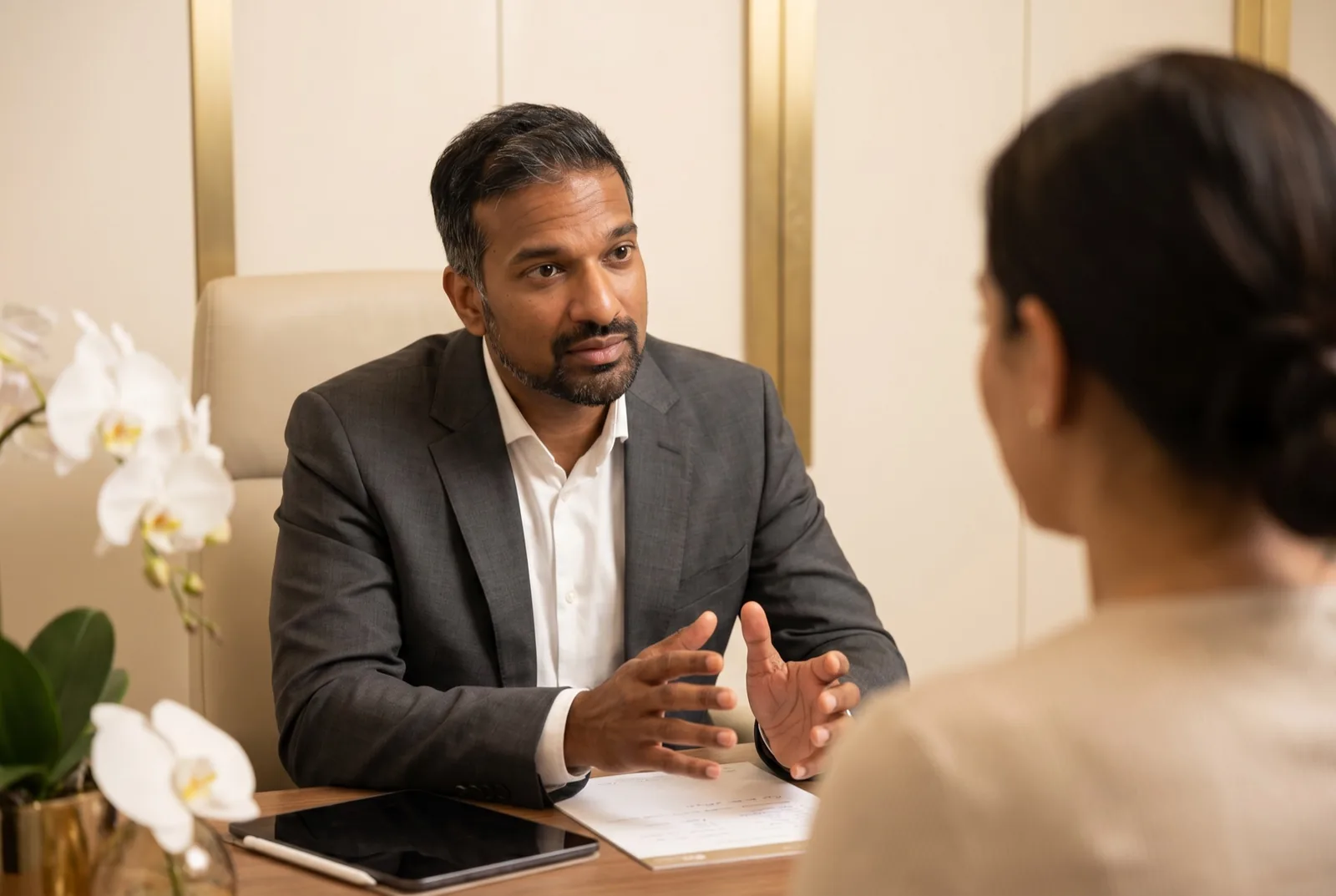 Mr Vijayan in consultation with a patient